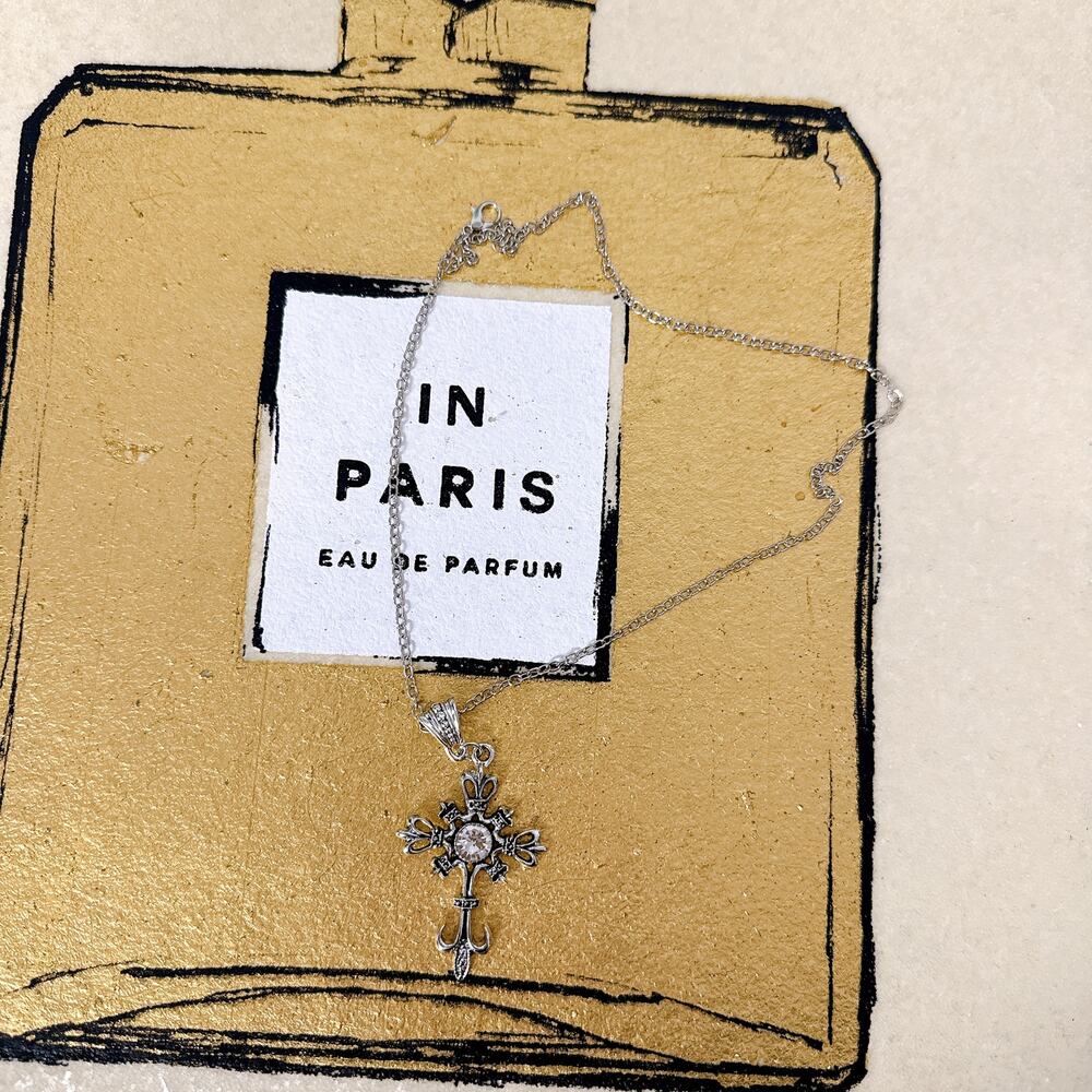 Silver‑Tone Ornate Cross Pendant Necklace with Crystal Accent